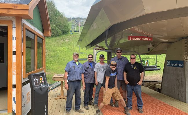 Employees at the base of Skimobile Express