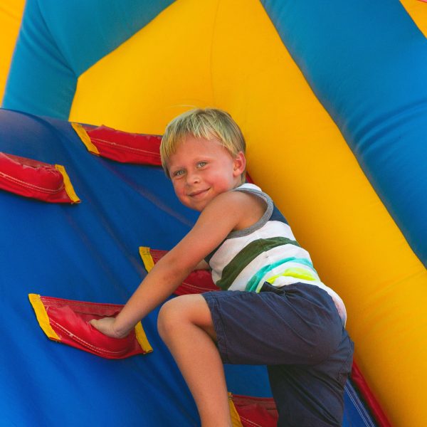 child climbing bouncy house